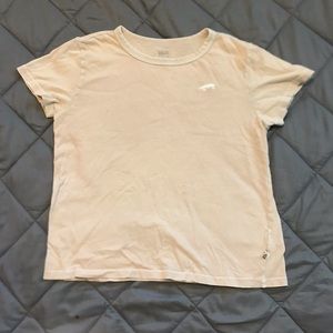 Light pink t-shirt fromVans off the wall.